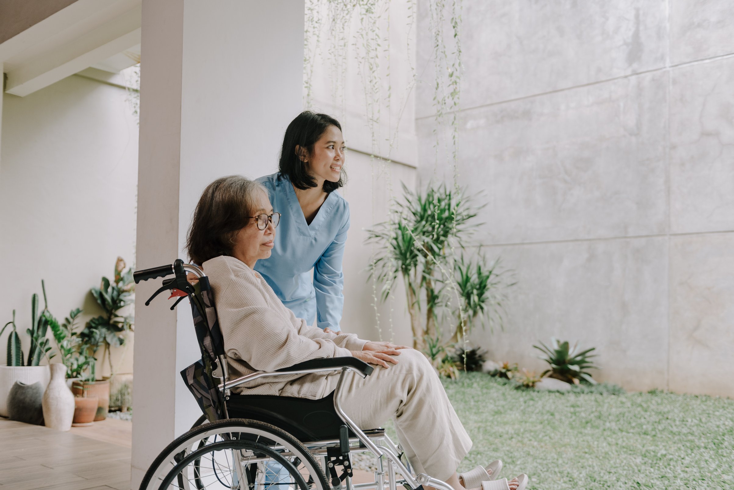 Nurse Taking Care of an Elderly Woman